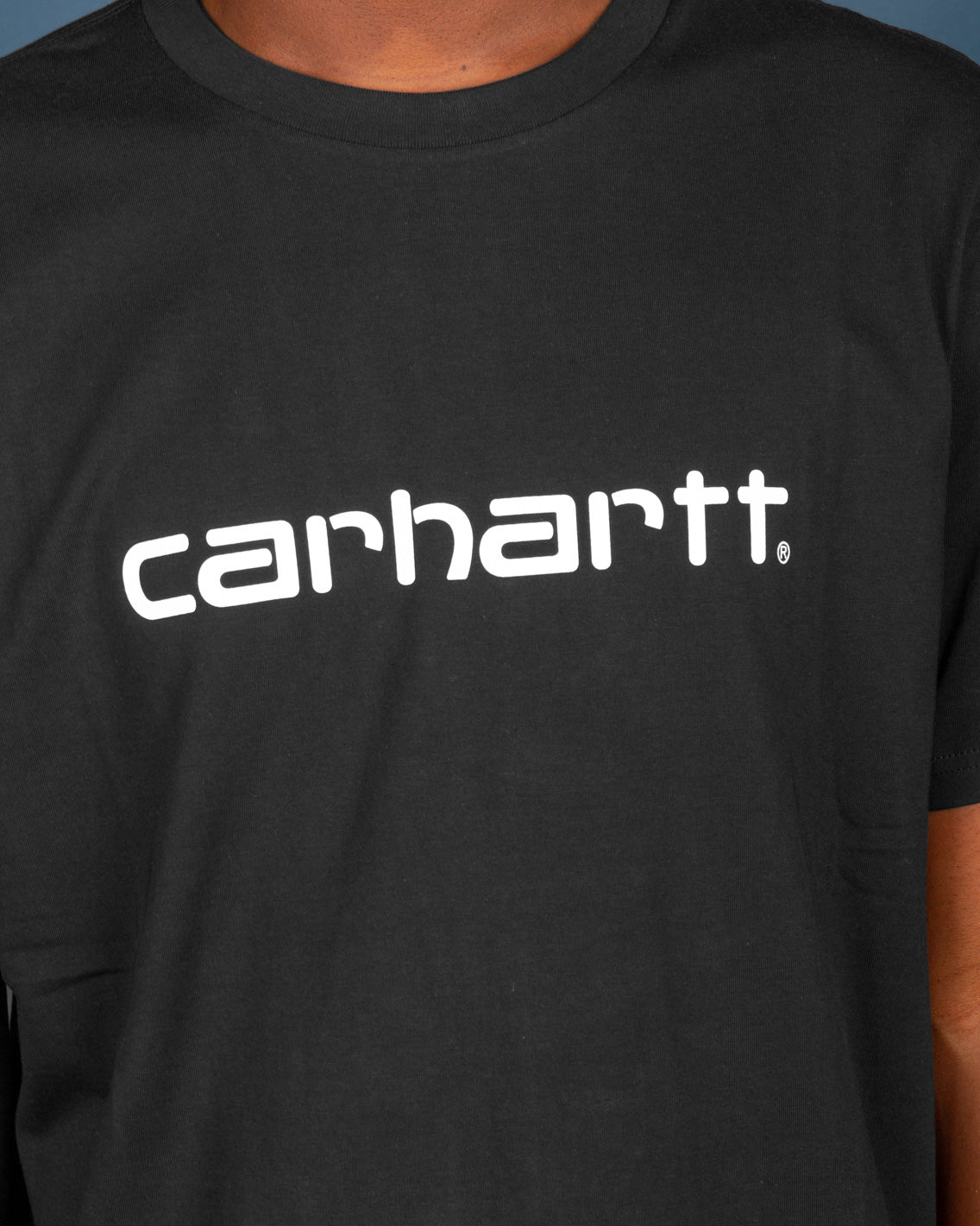 The Carhartt Script T-Shirt in Black features the iconic Carhartt logo printed on the front in white. Coming in a regular fit and featuring a comfortable ribbed neckline, this short-sleeve t-shirt is a perfect layering piece in your streetwear wardrobe.