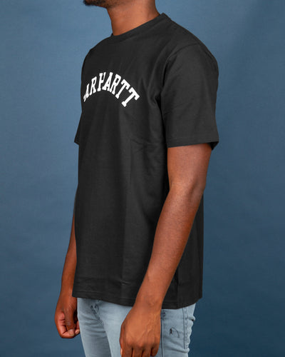 The Carhartt University Tee in Black features an arched Carhartt team logo printed in white on the front. Cut from premium cotton and finished with a comfortable ribbed neckline. This short-sleeved tee is perfect for layering with a jacket and bringing simplicity and classic to any outfit.
