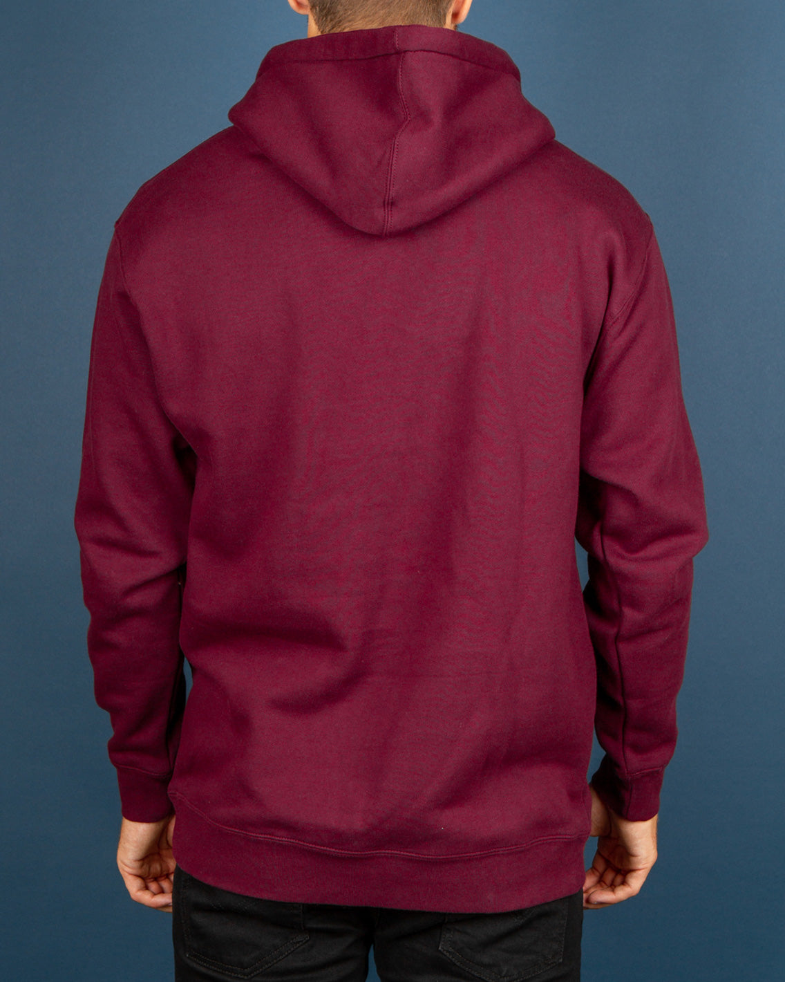 The Pass~Port Olive Puff Print Hoodie in Marron brings a comfortable and warm pullover style. Constructed from a premium cotton blend with a cosy fleece interior, this hoodie is quipped with an adjustable drawstring hood, front pouch pocket and ribbed trims. Signed off and stamped with a custom puff print logo graphic on the centre chest.